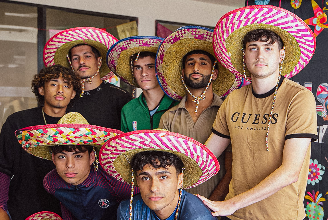 NAU soccer players smiling with sombreros